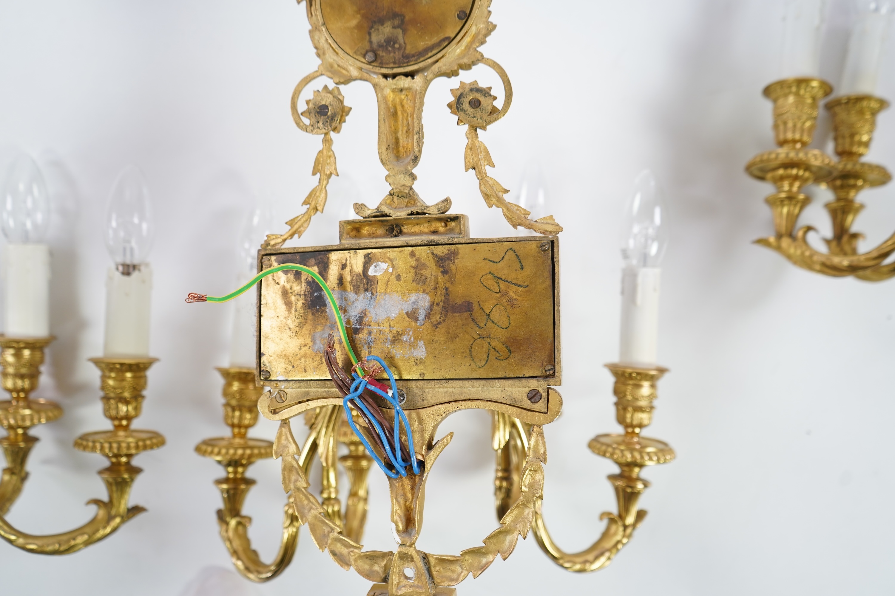 A set of four Adam style ormolu and jasper ware mounted wall appliques, early 20th century